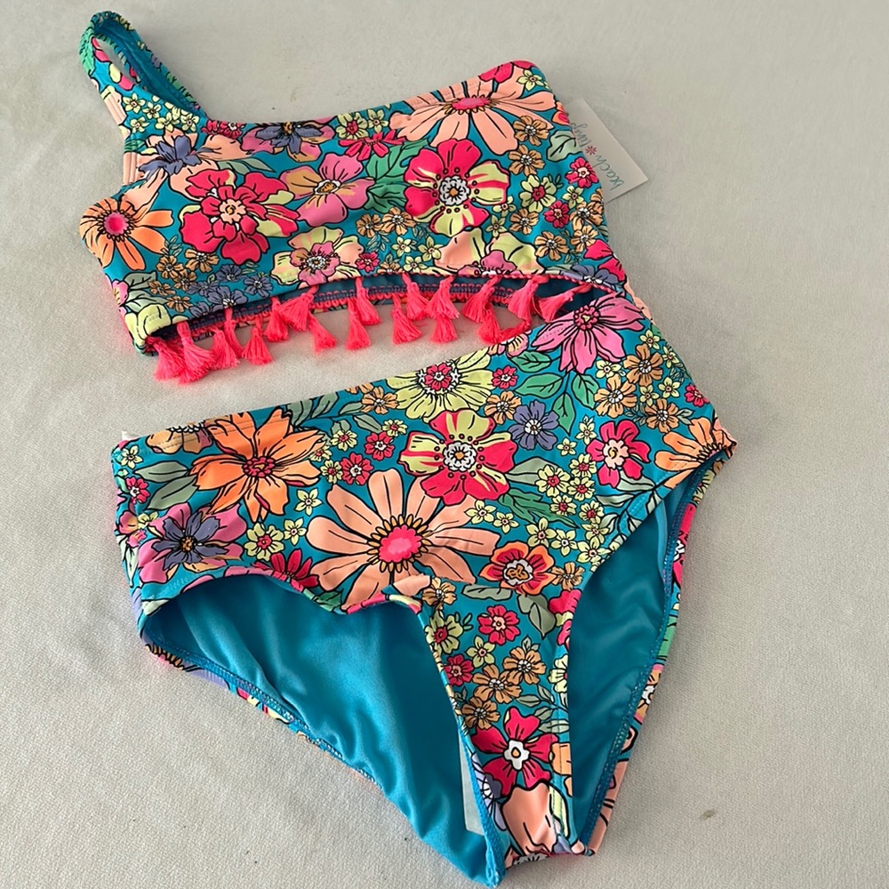 Girls never worn new one shoulder swimsuit fully lined has light padding in top